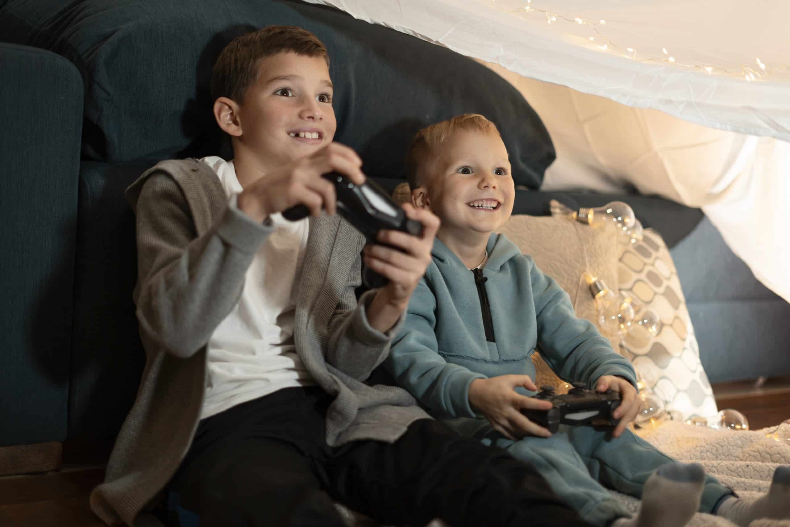niños con videojuegos